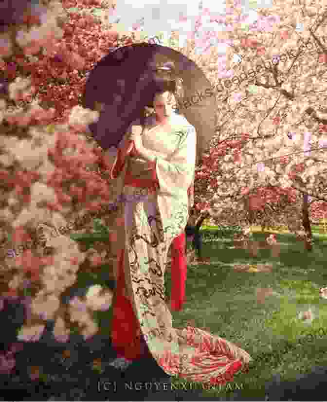 A Geisha In Traditional Attire Standing Under Cherry Blossom Trees Japan Julian Bound