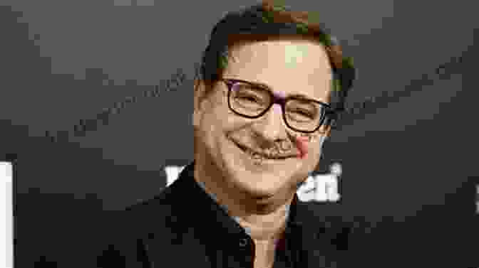 Bob Saget Smiling And Looking At The Camera STARS WE VE LOST IN 2024: Remembering The Celebrities Who Died This Year