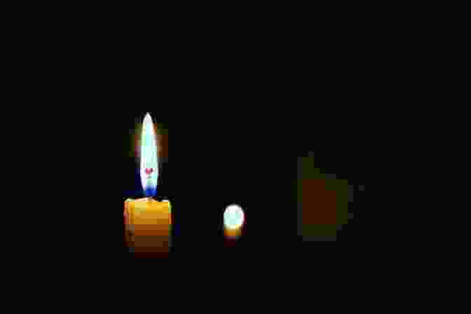 Image Of A Dim Candle Burning In A Dark Room. Words Of Worship: 30 Devotions Based On Songs And Hymns