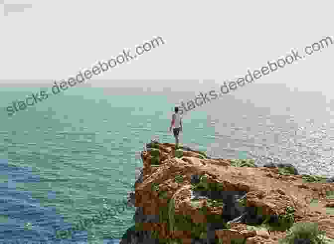 Image Of A Person Standing On The Edge Of A Cliff, Overlooking A Vast Ocean. Words Of Worship: 30 Devotions Based On Songs And Hymns