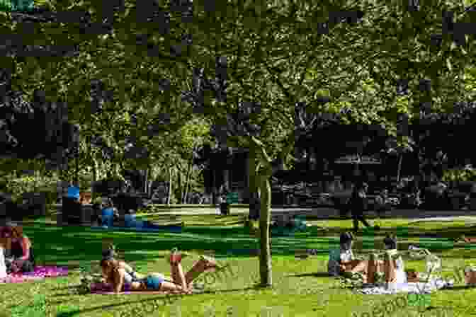 People Relaxing And Enjoying The Lush Greenery Of Jardim Da Estrela, Lisbon Lisbon Outdoors Antonio Lacarte
