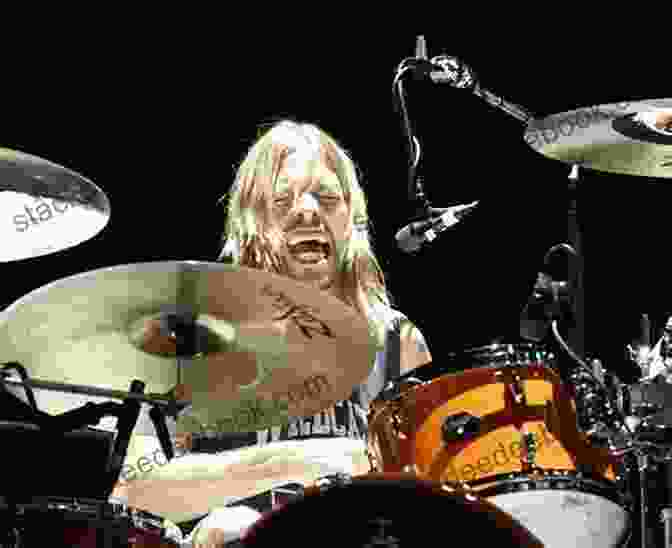 Taylor Hawkins Smiling And Playing Drums STARS WE VE LOST IN 2024: Remembering The Celebrities Who Died This Year